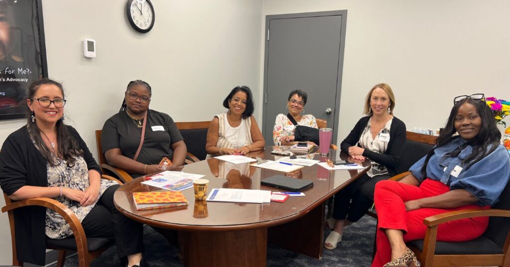 Group of women sitting around a table for the first Parent Cabinet meeting